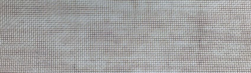 Stainless steel woven mesh- displaying the brown discolouration on the surface known as tea staining